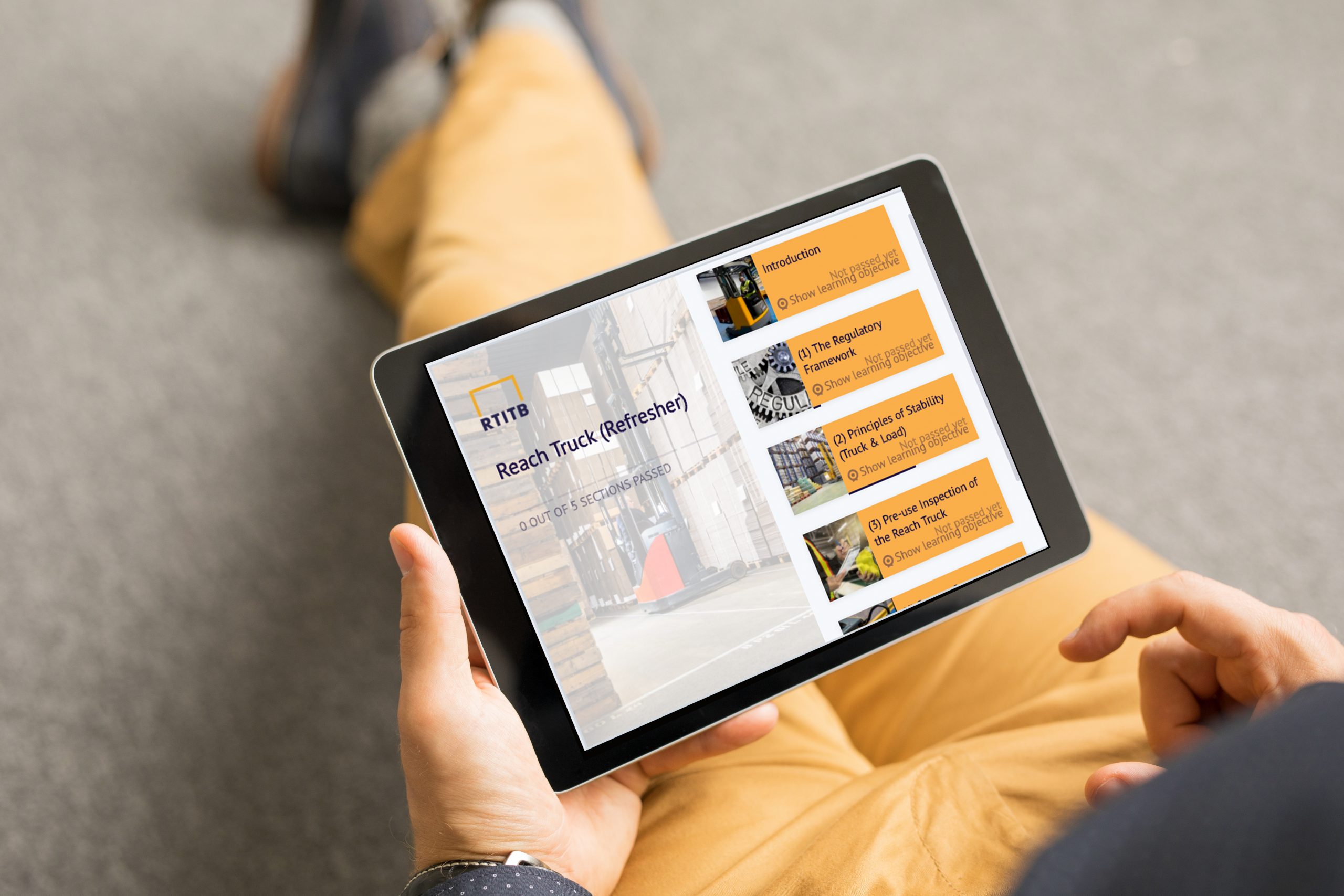 iPad on Lap_Man_Reach Truck refresher Reach Truck Refresher Training