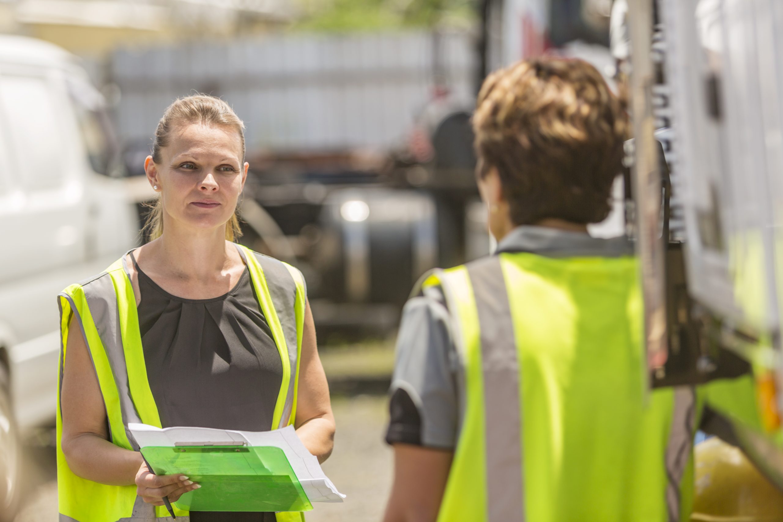 Women Working in the Transport Industry Wearing Hi-Vis Clothes Van-assessor